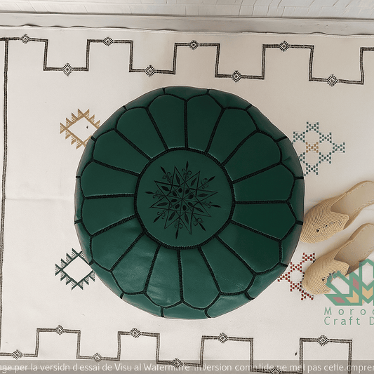 Green leather ottoman on a patterned rug with 'Moroccan Craft' branding.