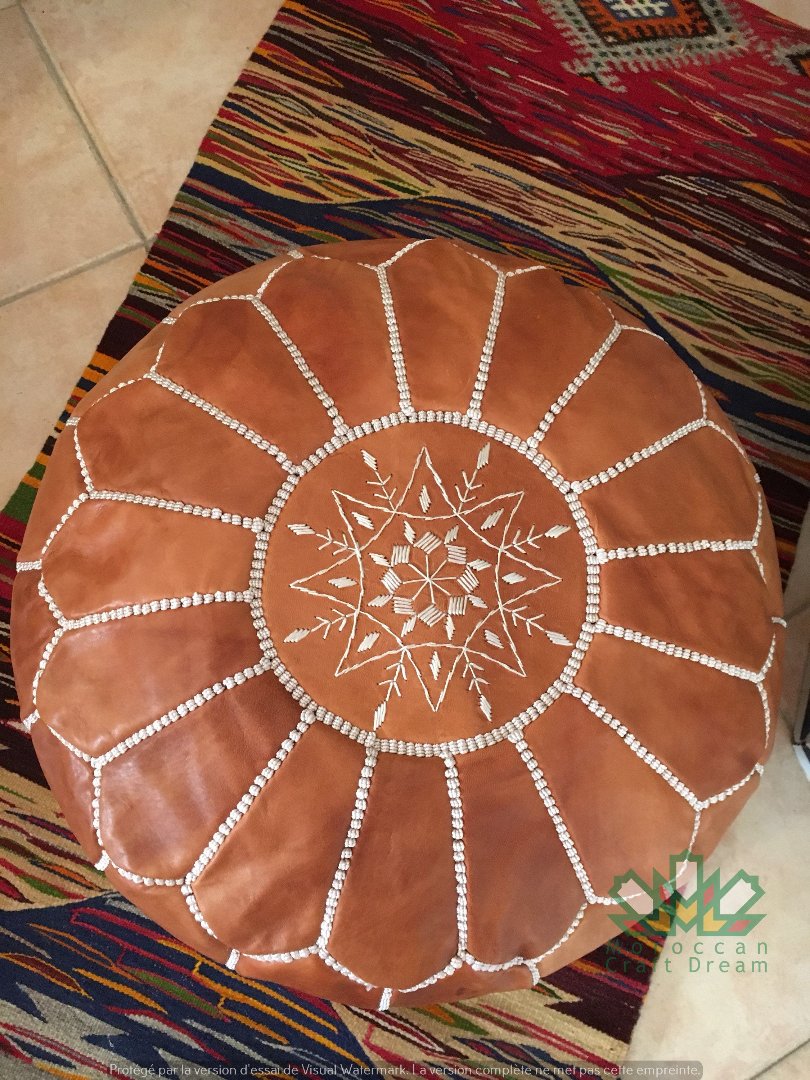 Artisan Caramel Moroccan leather pouf, handmade with authentic craftsmanship to elevate any room's decor.