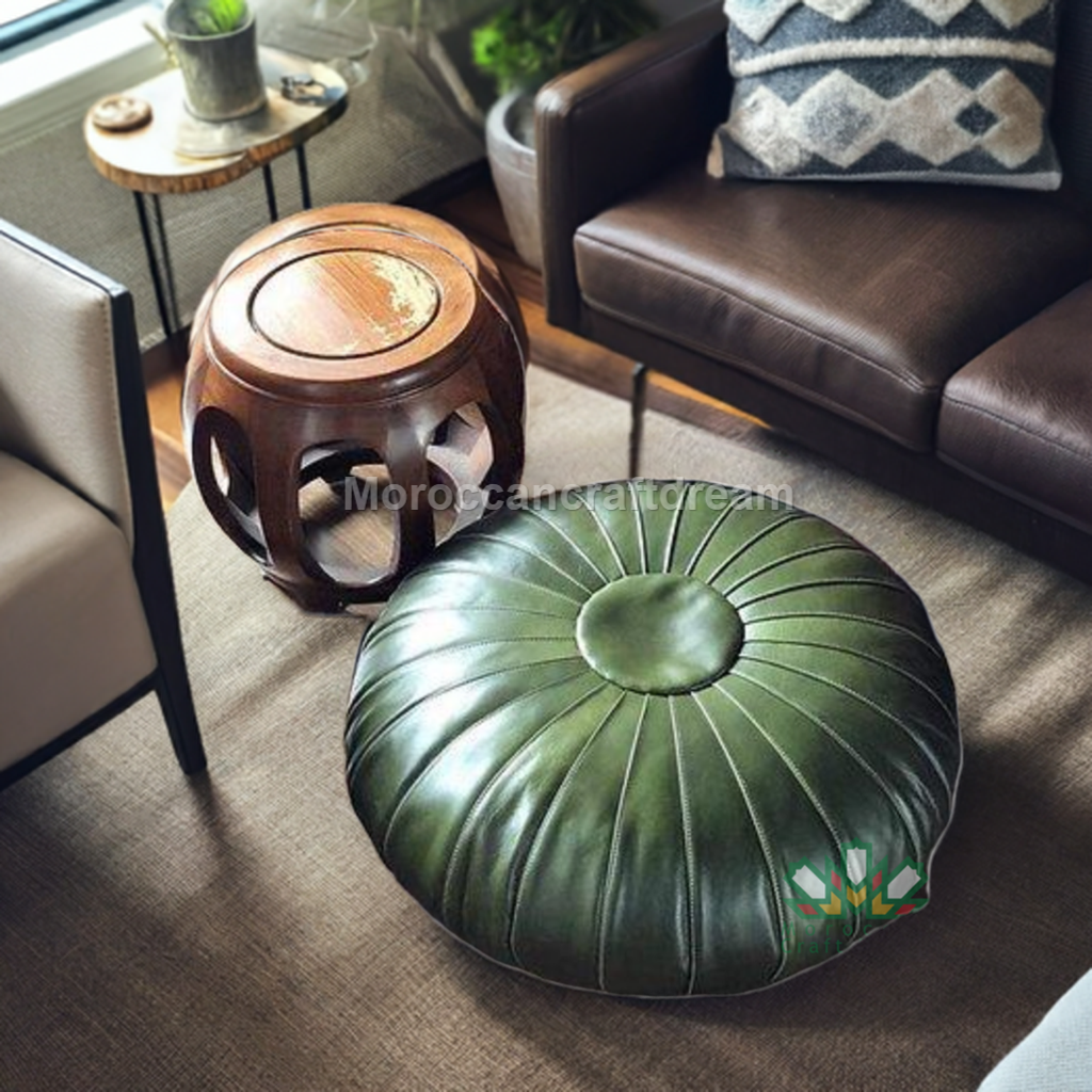 Green Handcrafted leather Moroccan pouf ottoman and footstool in natural tones, featuring traditional stitching and soft, durable materials.