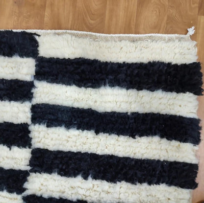 Berber area rugs and Moroccan carpets featuring traditional designs, handcrafted from high-quality materials for authentic home decor.