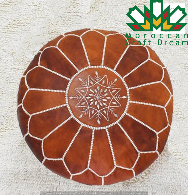 Tan Moroccan leather pouf ottoman by Moroccancraftdream, ideal for living room or bedroom decor.