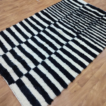 Berber area rugs and Moroccan carpets featuring traditional designs, handcrafted from high-quality materials for authentic home decor.