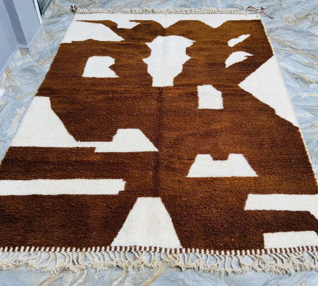 Berber area rugs and Moroccan carpets featuring traditional designs, handcrafted from high-quality materials for authentic home decor.