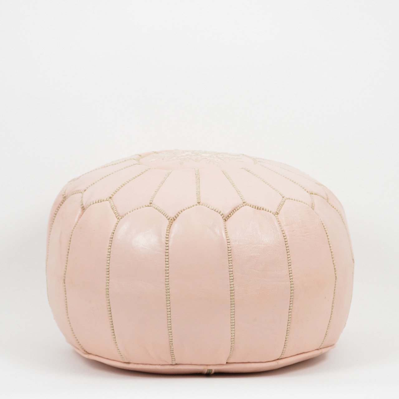 Genuine leather nude Moroccan pouf ottoman, handcrafted with traditional techniques for a stylish addition to any space.