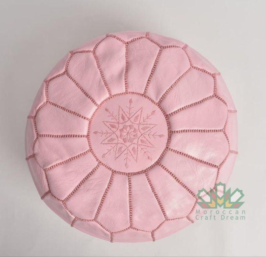 Elegant and functional Pink Moroccan leather pouf ottoman in a classic design, suitable for modern and traditional interiors.