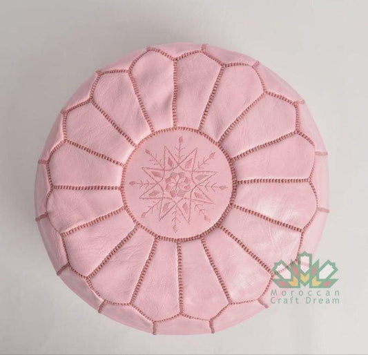 Elegant and functional Pink Moroccan leather pouf ottoman in a classic design, suitable for modern and traditional interiors.