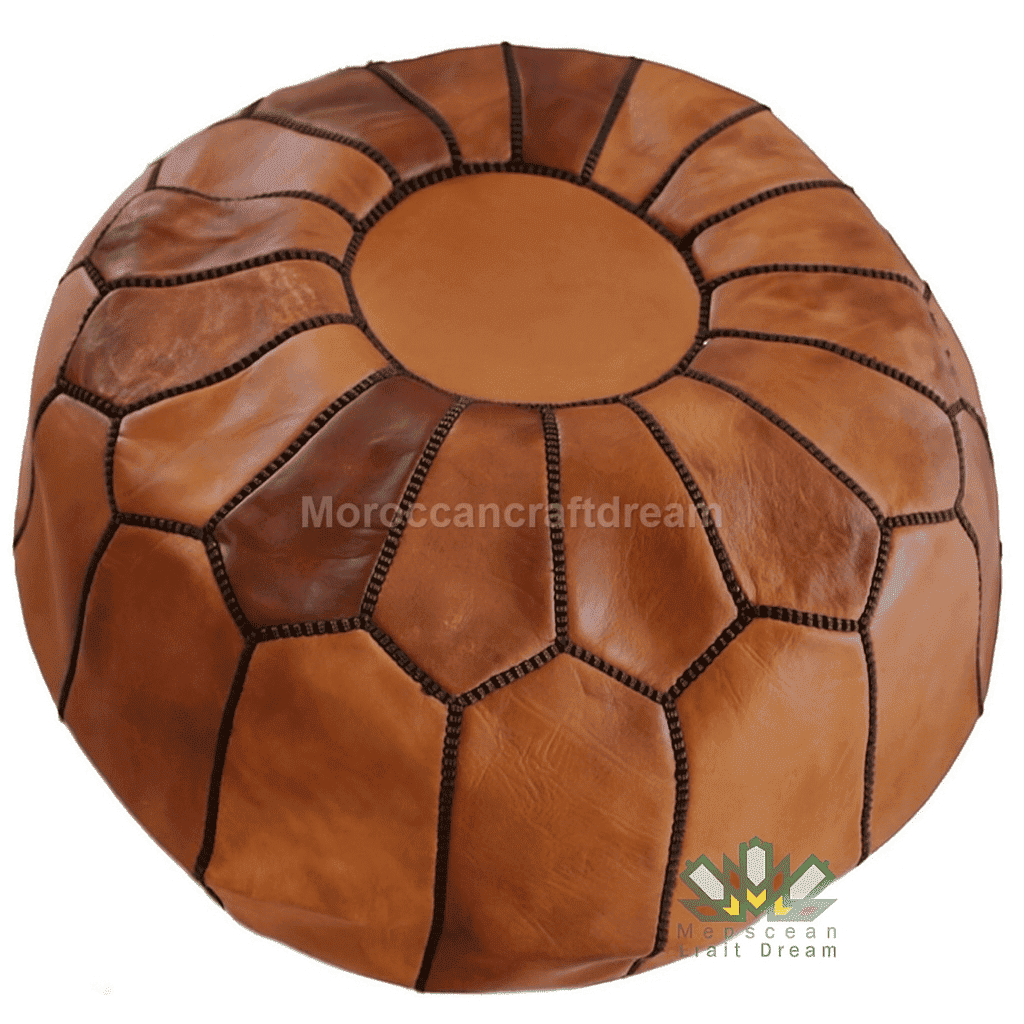 Brown leather pouf with geometric pattern on a white background, featuring 'Moroccan Craft Dream' branding.