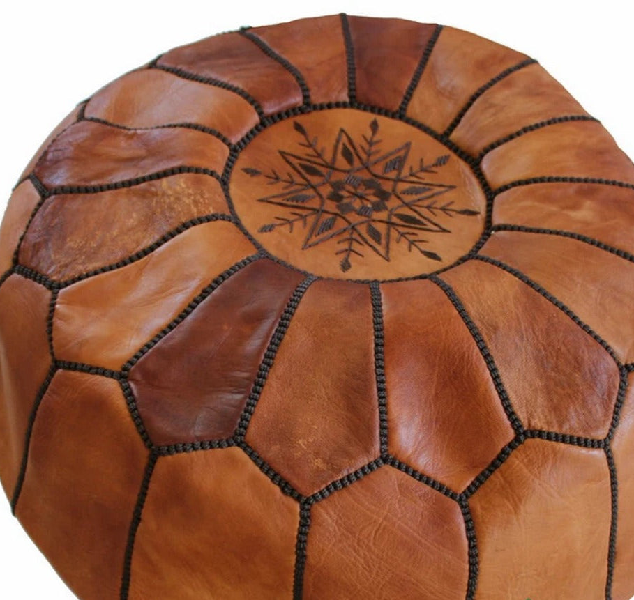 Handcrafted Moroccan leather poufs, ottomans and footstool in natural tones, featuring traditional stitching and soft, durable materials.