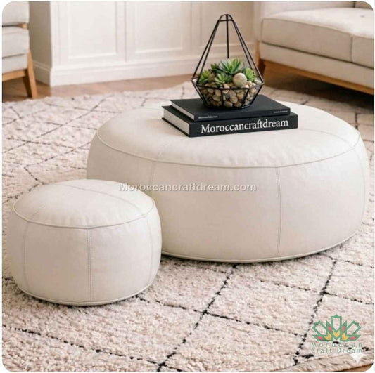 Round white ottomans on a textured rug with 'Moroccancraftdream' branding.