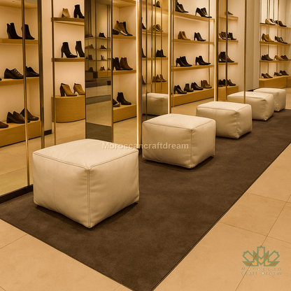 Shoe display with white ottomans in a store setting, shoes shopping