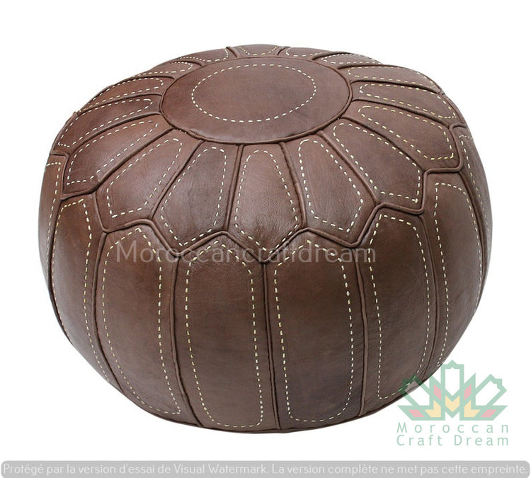 Handcrafted Moroccan leather poufs, ottomans and footstool in natural tones, featuring traditional stitching and soft, durable materials.