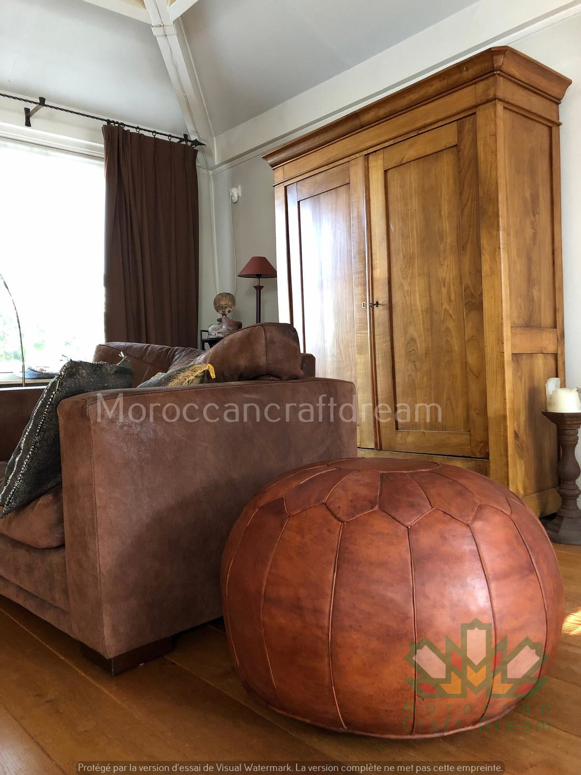Handcrafted Moroccan leather poufs, ottomans and footstool in natural tones, featuring traditional stitching and soft, durable materials.