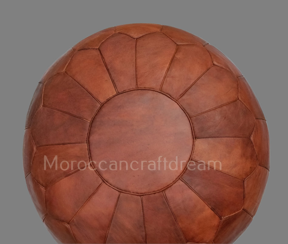 Handcrafted Moroccan leather poufs, ottomans and footstool in natural tones, featuring traditional stitching and soft, durable materials.