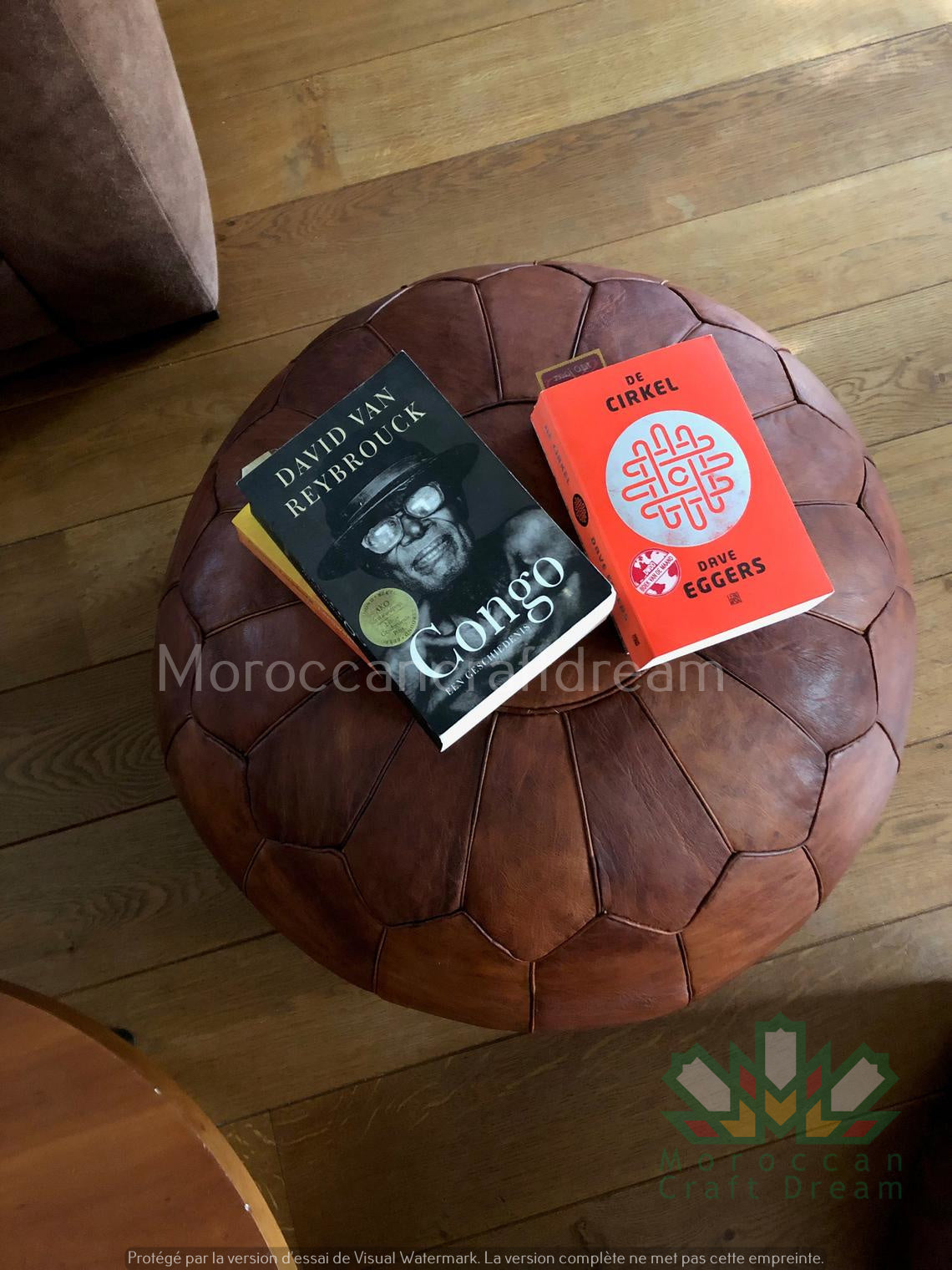 Handcrafted Moroccan leather poufs, ottomans and footstool in natural tones, featuring traditional stitching and soft, durable materials.