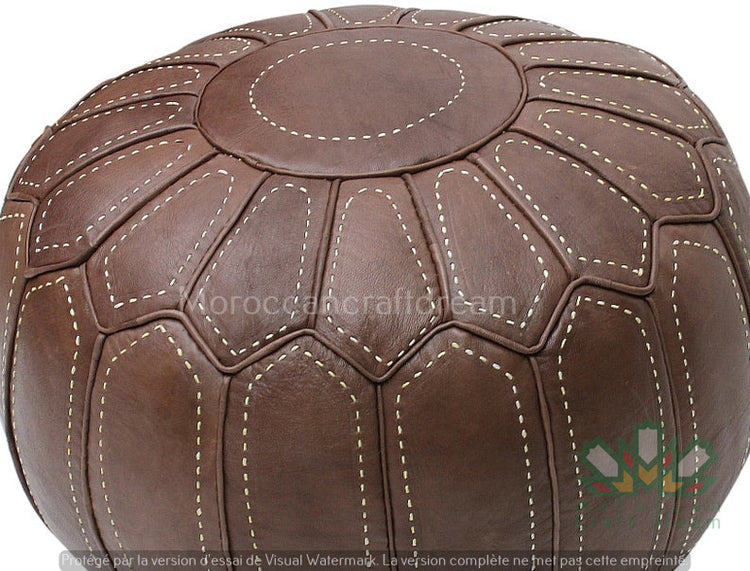 Handcrafted Moroccan leather poufs, ottomans and footstool in natural tones, featuring traditional stitching and soft, durable materials.