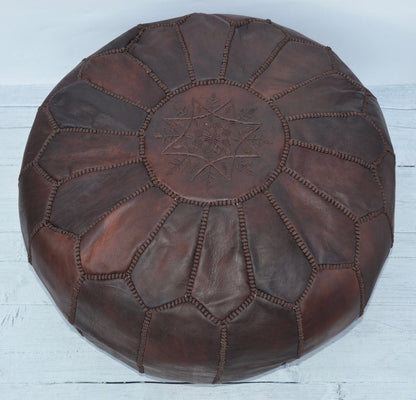 Elegant and functional Moroccan leather pouf ottoman in a classic design, suitable for modern and traditional interiors.