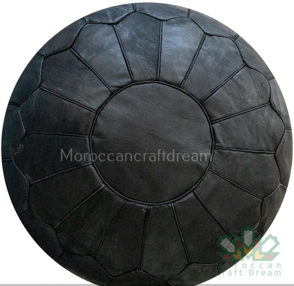 Black Luxury Moroccan leather ottoman for living room decor, blending functionality with authentic Moroccan style.