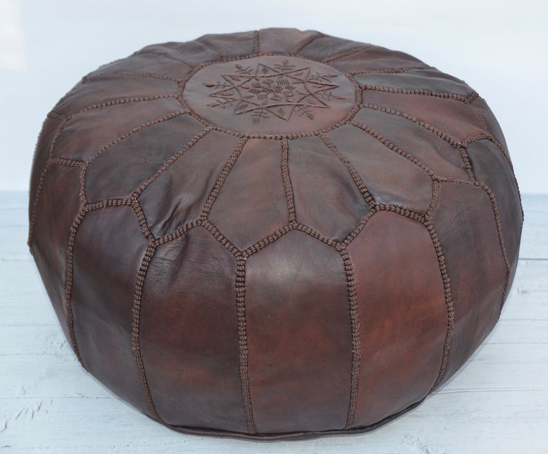 Large brown handmade Moroccan leather pouf ottoman in neutral tones, designed for living room decor and additional seating.