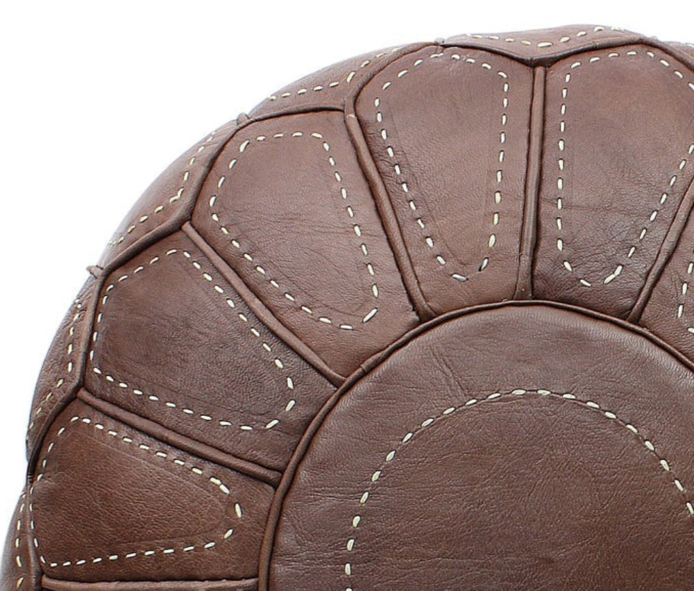 Handcrafted Moroccan leather poufs, ottomans and footstool in natural tones, featuring traditional stitching and soft, durable materials.