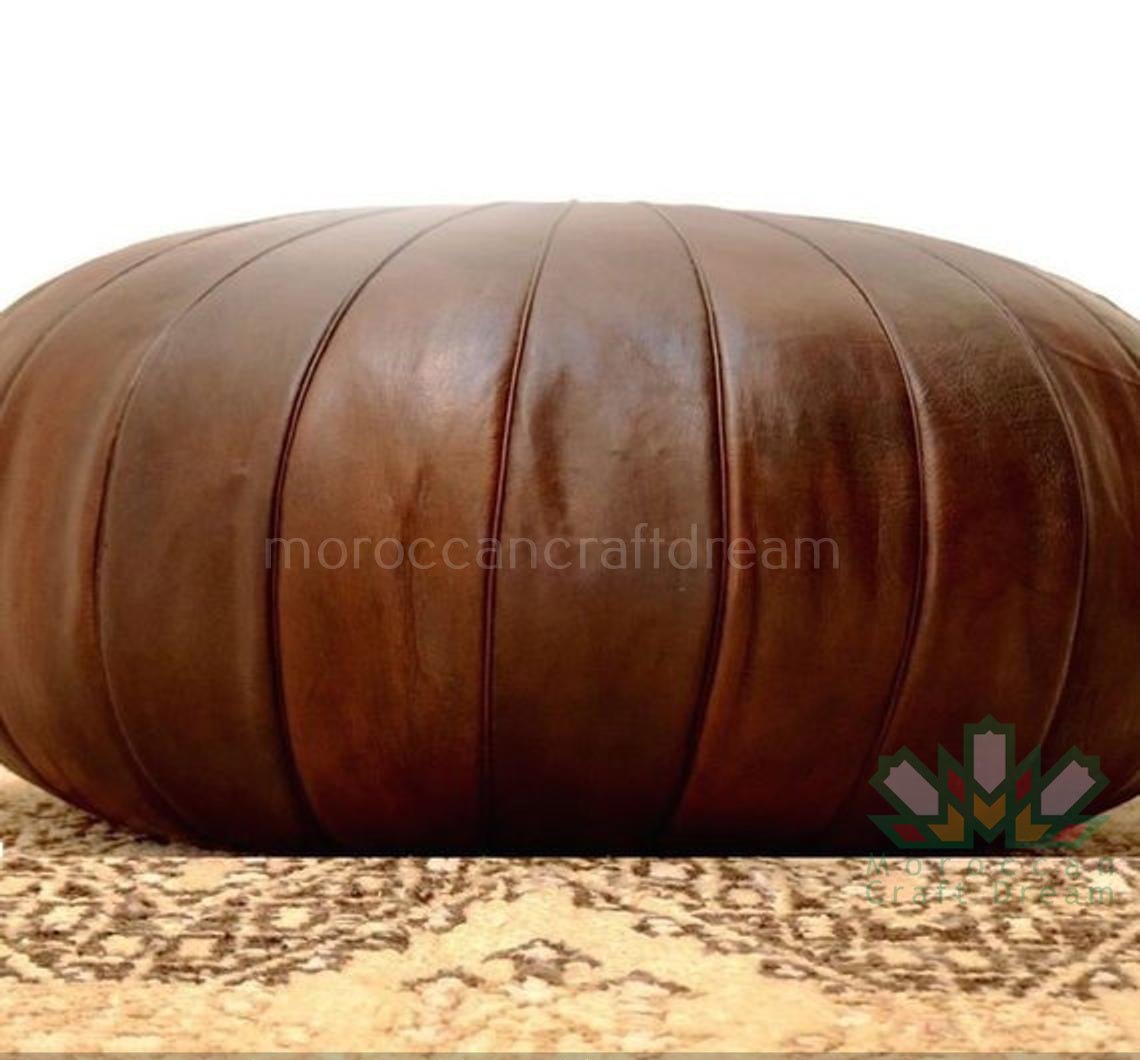 Handcrafted leather chocolate brown Luxury Moroccan leather ottoman for living room decor, blending functionality with authentic Moroccan style.