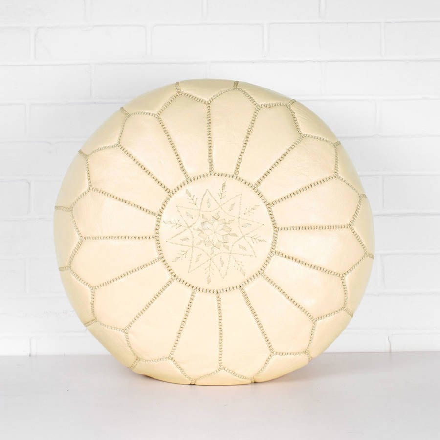 Cream Handmade Moroccan leather pouf ottoman used as a coffee table, in authentic goatskin leather, perfect for versatile home decor.