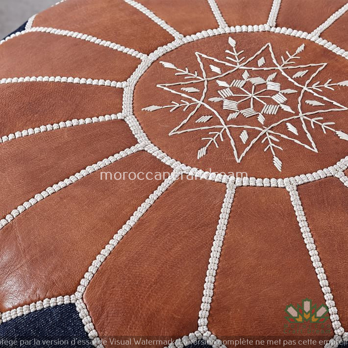 Moroccan poufs and ottomans footstool used as a coffee table, handcrafted in wool and leather with traditional stitching and durable design