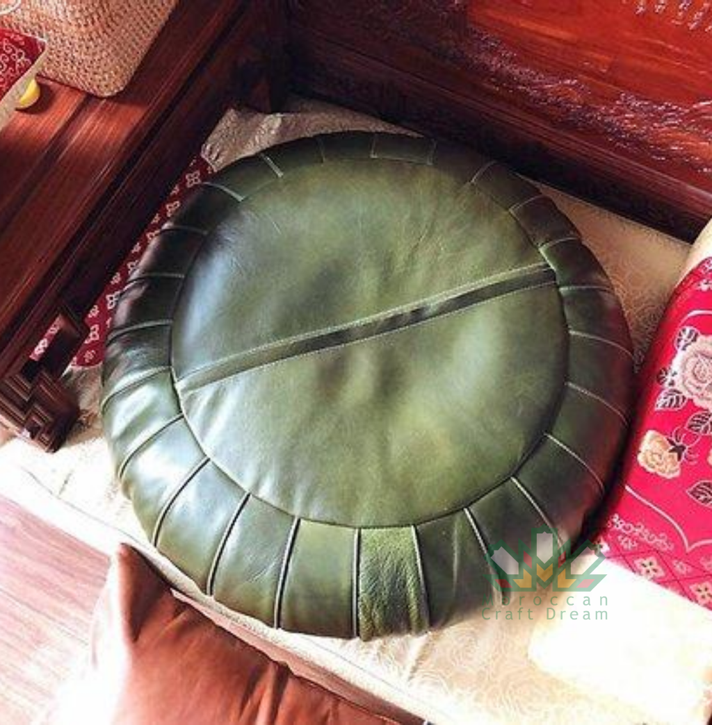 Green handmade round classy Moroccan leather ottoman for living room decor, blending functionality with authentic Moroccan style.