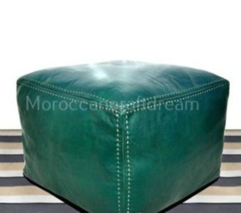 Handmade green leather Moroccan poufs, ottomans and footstool in natural tones, featuring stitching and soft, durable materials.