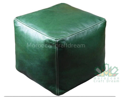 Green Handcrafted leather Moroccan poufs, ottomans and footstool in natural tones, featuring traditional stitching and soft, durable materials.