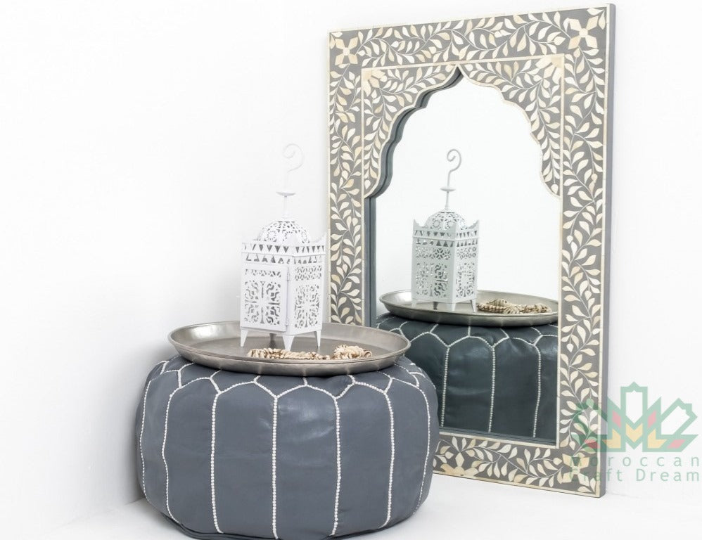 Grey Handmade Moroccan leather pouf with intricate geometric designs, perfect for enhancing living room style.