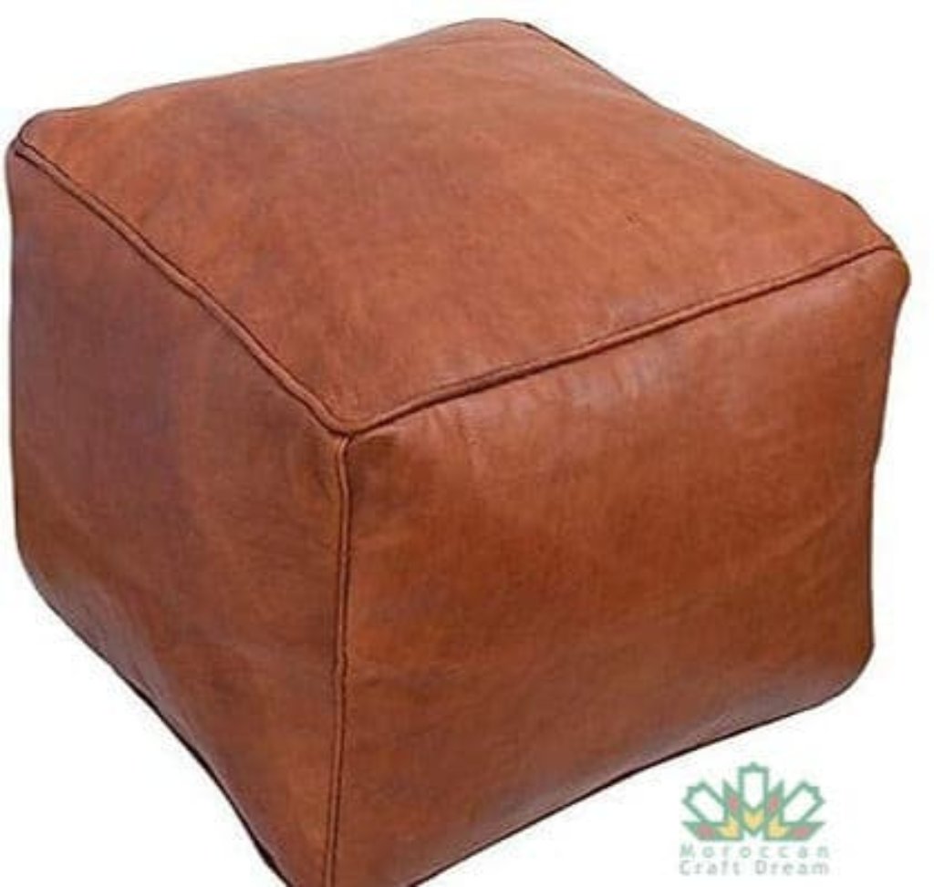 Hnadmade tan leather Moroccan poufs, ottomans and footstool in natural tones, featuring traditional stitching and soft, durable materials.