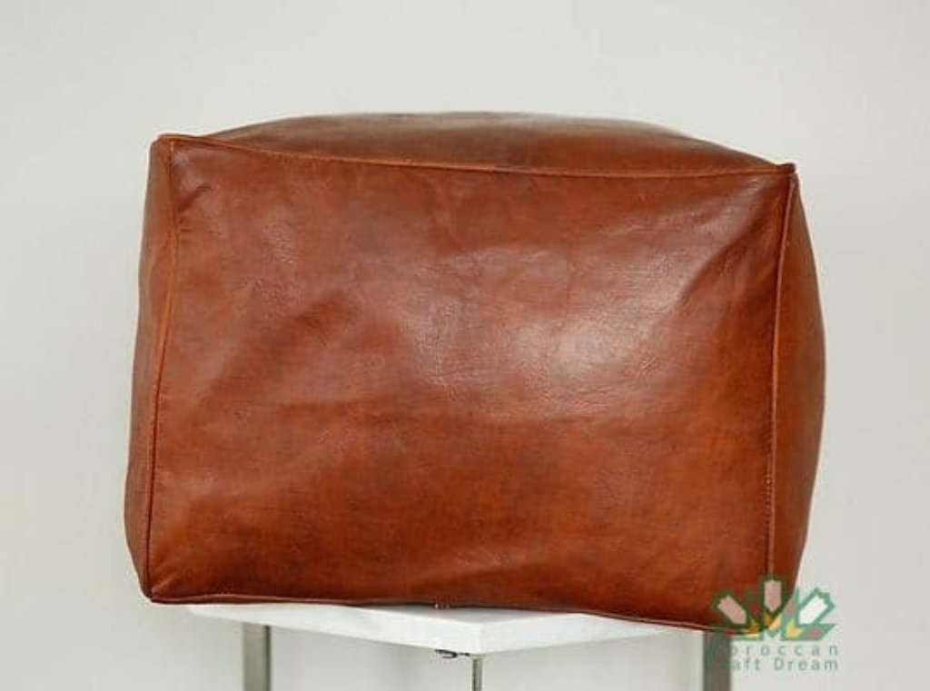 Real leather tan Moroccan poufs, ottomans and footstool in natural tones, featuring traditional stitching and soft, durable materials.