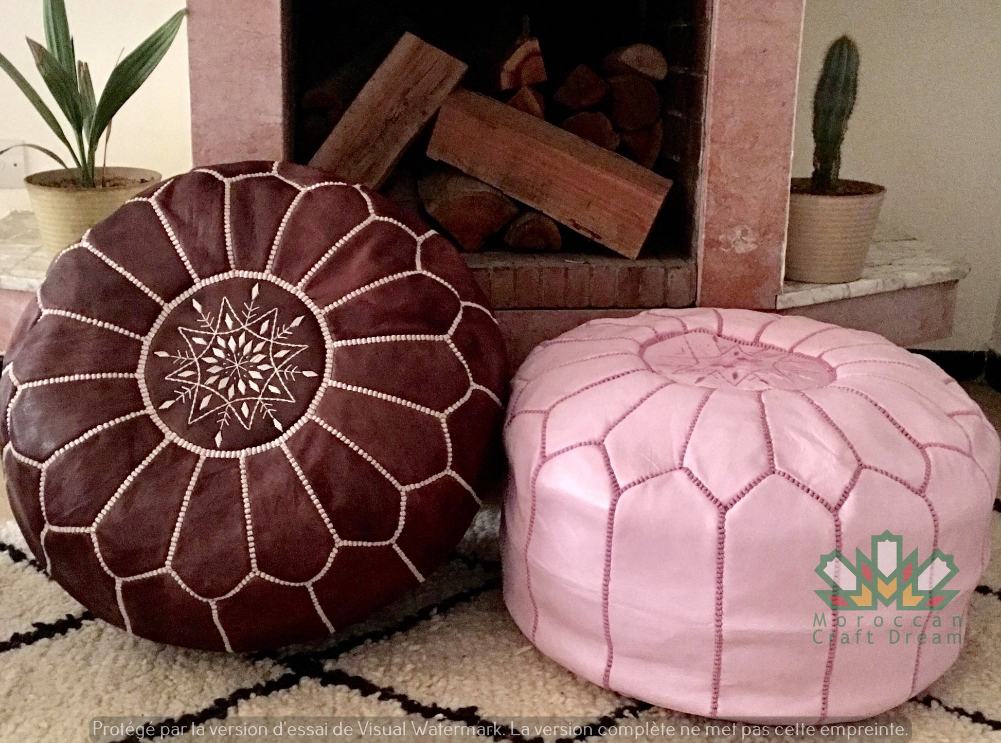 Round Moroccan leather poufs used as a coffee table, handcrafted with durable materials and traditional stitching in natural tones.