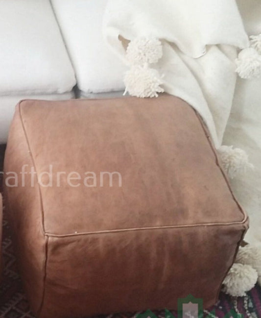 Handcrafted Natural dark Moroccan leather poufs, ottomans and footstool in natural tones, featuring traditional stitching and soft, durable materials.
