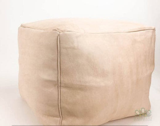 Handmade natural leather Moroccan poufs, ottomans and footstool in natural tones, featuring traditional stitching and soft, durable materials.
