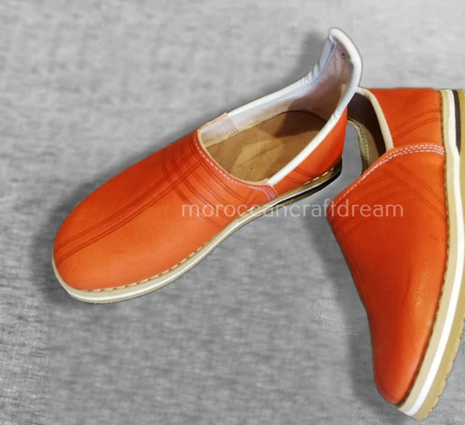 handmade leather slipper in orange color