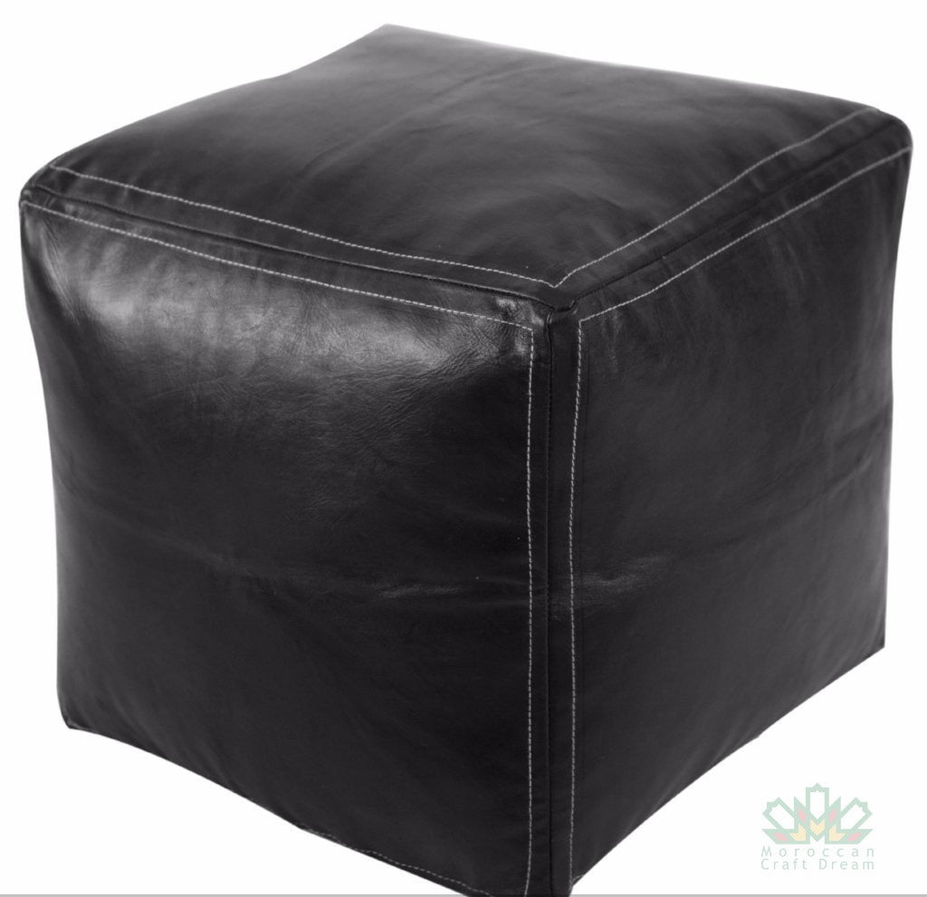 Handcrafted black Moroccan leather poufs, ottomans and footstool in natural tones, featuring traditional stitching and soft, durable materials.