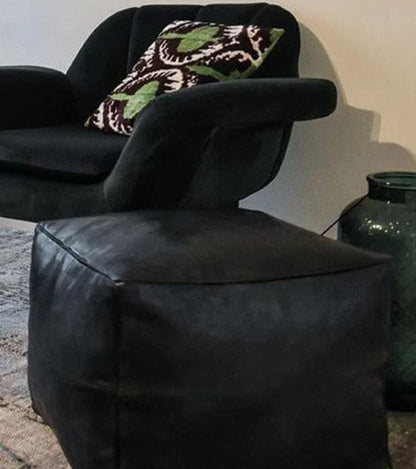 Handcrafted leather Moroccan poufs, ottomans and footstool in natural tones, featuring traditional stitching and soft, durable materials.