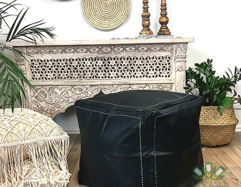 Handcrafted Moroccan leather poufs, ottomans and footstool in natural tones, featuring traditional stitching and soft, durable materials black color.