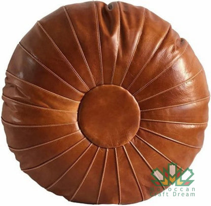 Tan Round Versatile Moroccan leather pouf ottoman, suitable as additional seating, footrest, or stylish coffee table.