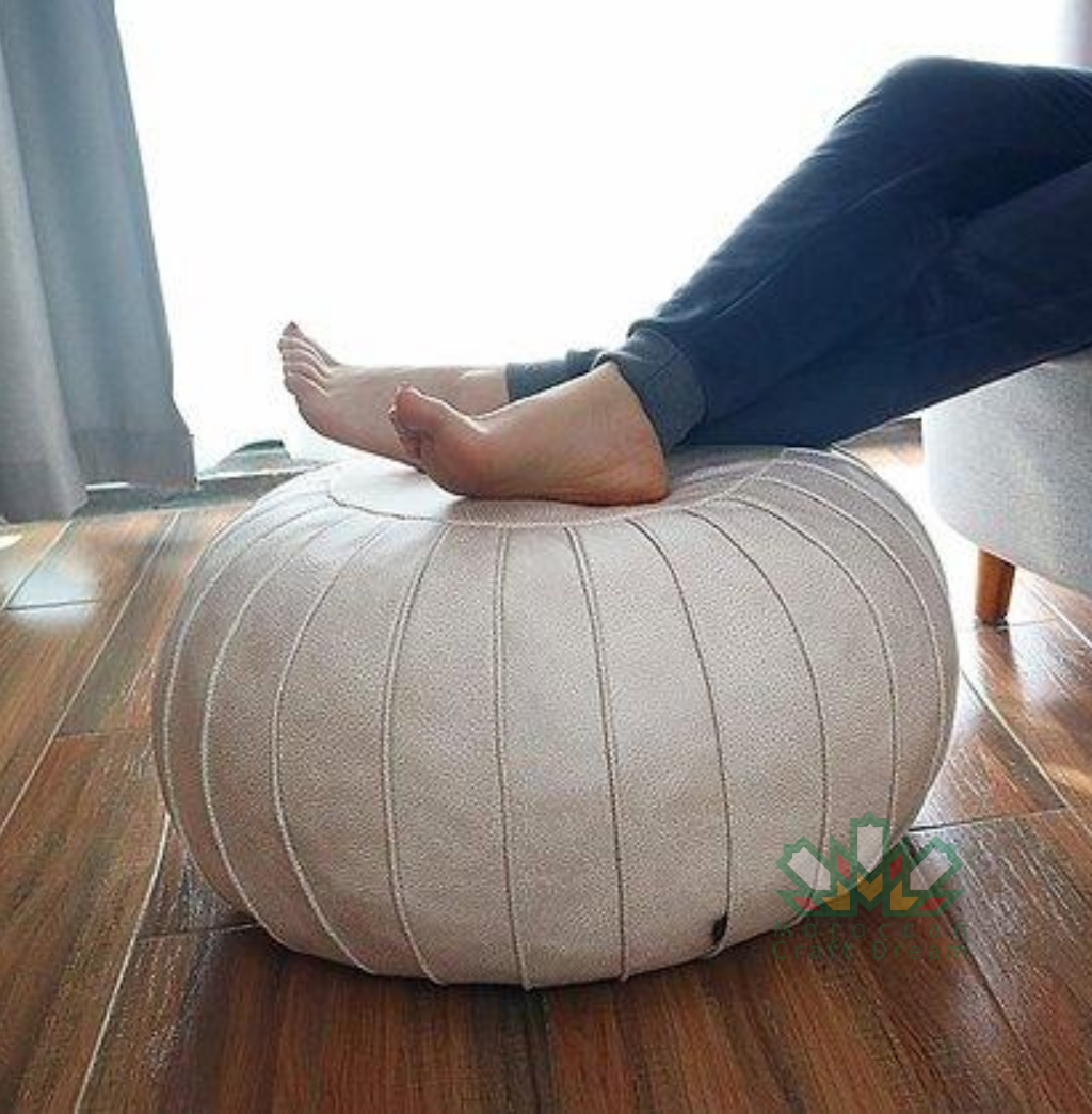 White handmade round Classy Elegant Moroccan leather ottoman designed to add a touch of sophistication and versatility to any room.