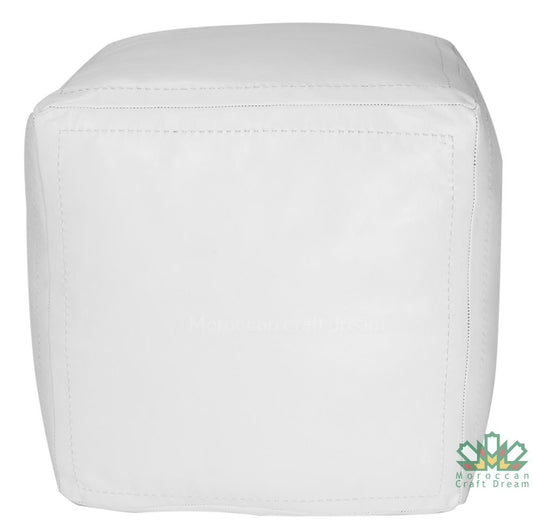 White Handcrafted leather Moroccan poufs, ottomans and footstool in natural tones, featuring traditional stitching and soft, durable materials.