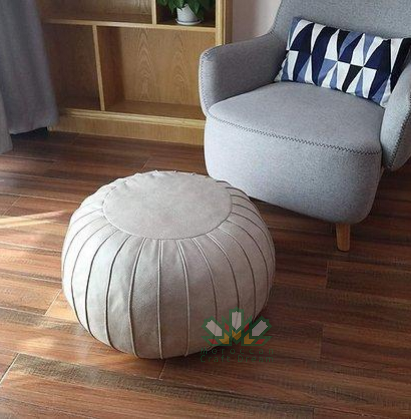 White handmade round Moroccan pouf ottoman in genuine leather, perfect for use as a versatile coffee table or footrest. This Moroccan leather ottoman enhances living room decor with its elegant design and multifunctional use.